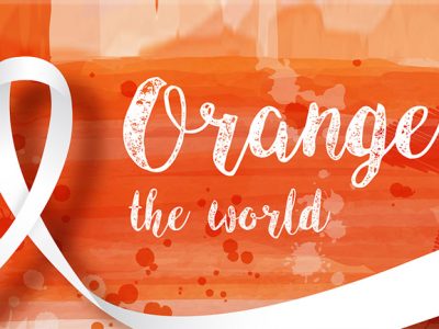 Schriftzug Orange the World auf orangenem Hintergrund