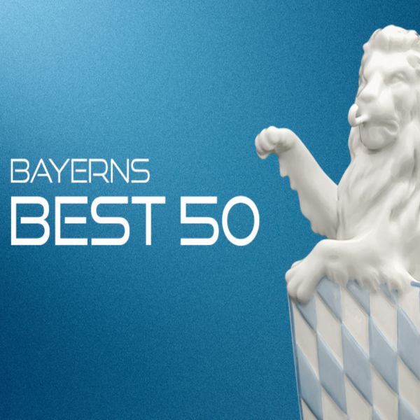 Schriftzug "Bayern Best 50" neben einem weißen bayerischen Löwen mit blau-weißem Wappen.